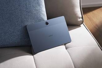 A tablet on a couchAI-generated content may be incorrect.